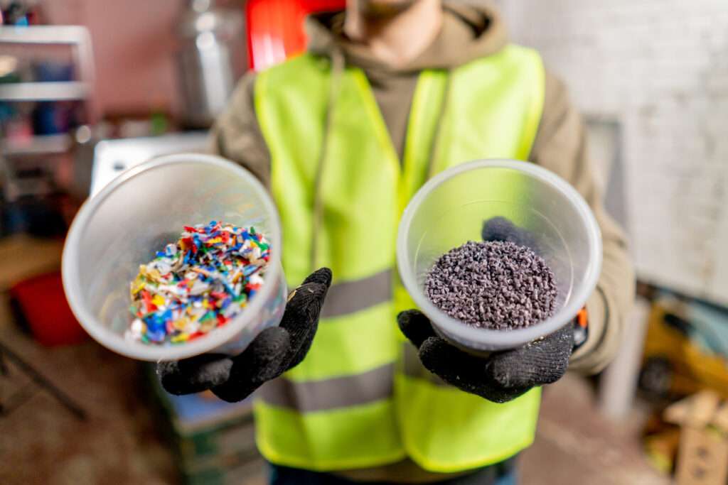 Person holding shredded bottle caps in containers